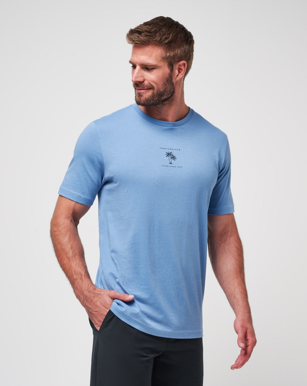 Blue t-shirt with graphic design on chest, made of cotton and polyester blend.