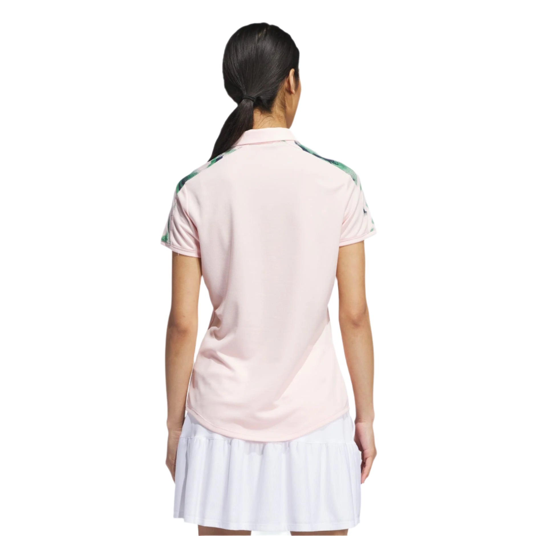Adidas women’s pink polo shirt with green and white stripes on the sleeves.