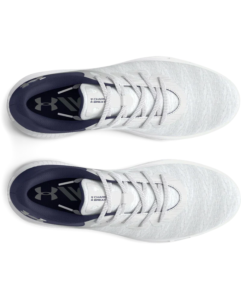White under armour baseball cleat with black accents and laces.