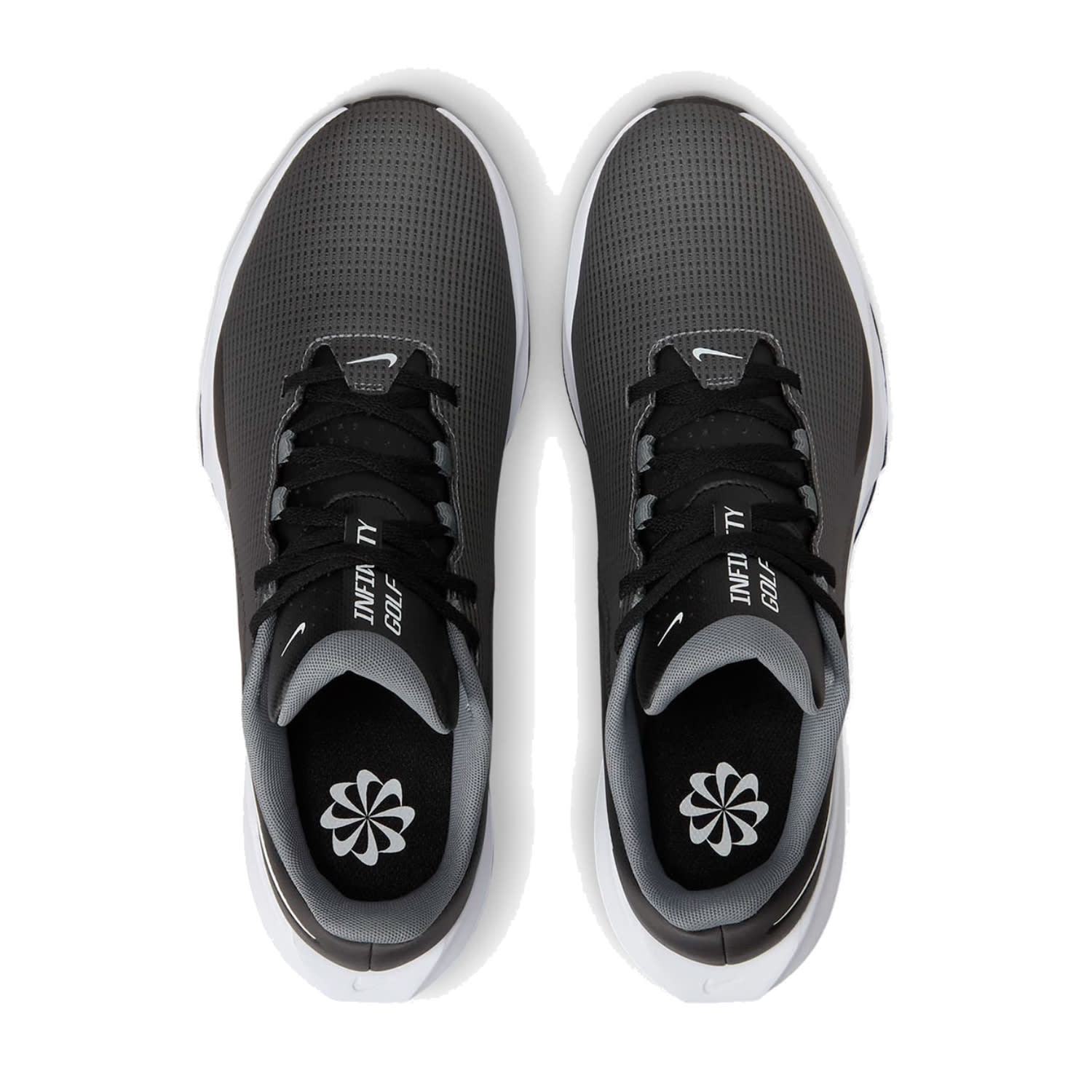 Black and white nike revolution 5 running shoes with mesh upper, rubber sole.