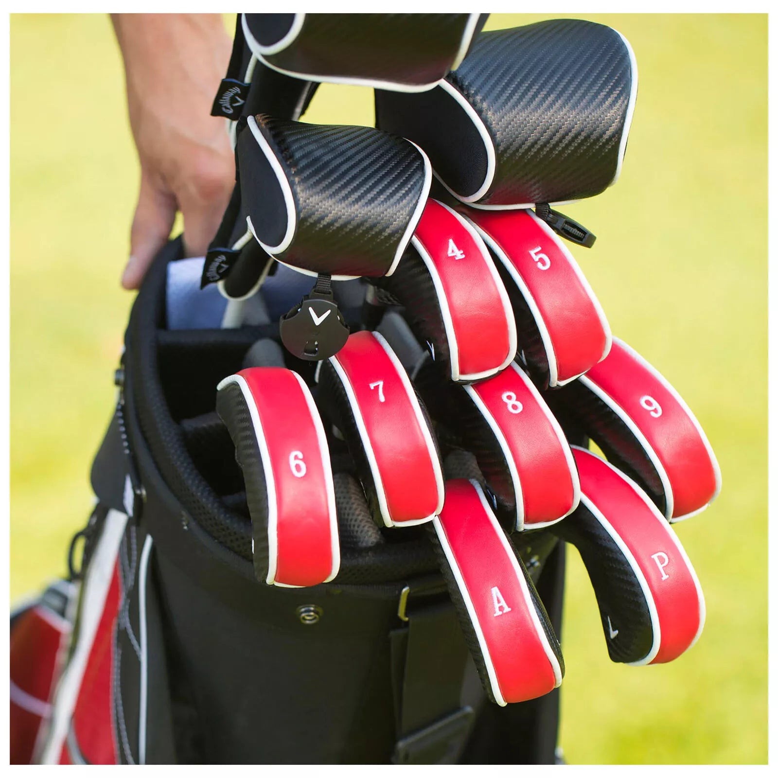 Red and black golf club set with white lettering, carbon fiber accents.